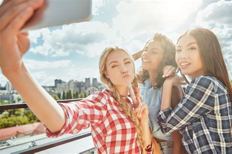 Funny Selfie With Friends Group Of Cheerful And Young Women Are Making Selfie And Smiling At