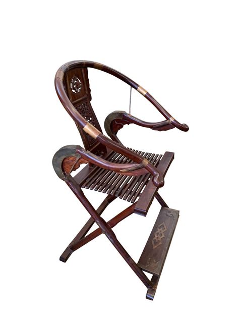 This folding chair can be used around a kitchen or dining room table, and it has a padded seat for maximum comfort. Pair of Chinese Rosewood Horseshoe Folding Chairs For Sale ...