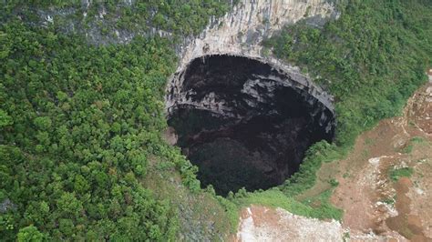 Scientists Find Cluster Of 19 Giant Sinkholes In Southern China The