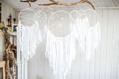 White Dream Catchers Hanging From A Tree Branch