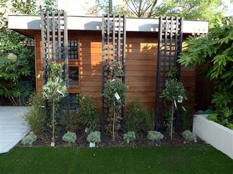 Because a framed view often is much more attractive than a completely revealed view, give serious thought to planting taller trees on either side of your house and at least one behind it. Modern Garden Design Ideas London - London Garden Design