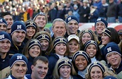 US President George W. Bush huddles with the Cheerleaders from the US ...