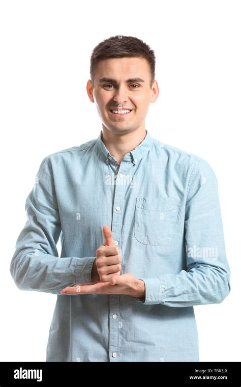 Young Deaf Mute Man Using Sign Language On White Background Stock Photo