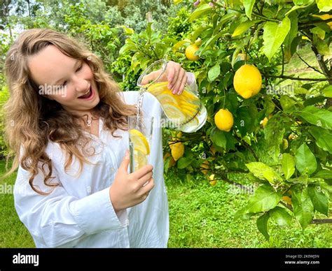 Its Just A Lemon Paradise A Teenage Girl Stands Against The Backdrop