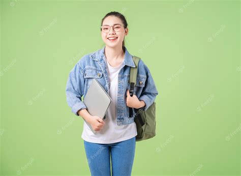 Premium Photo Photo Of Young Asian College Girl On Green Background