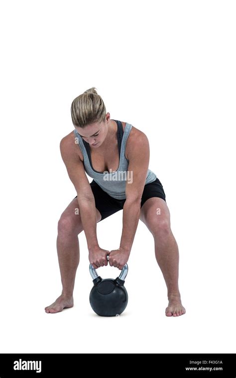 Serious Muscular Woman Lifting Kettlebell Stock Photo Alamy