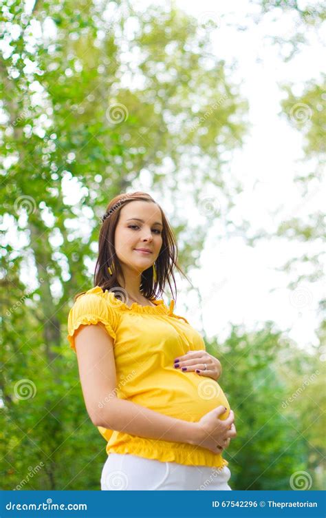 Beautiful Pregnant Woman In The Park Stock Photo Image Of Positive