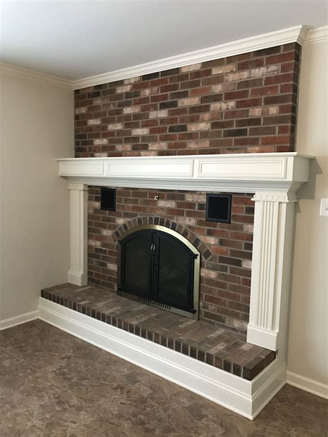 Updated Brick Fireplace With New Surround Trim Around Hearth And