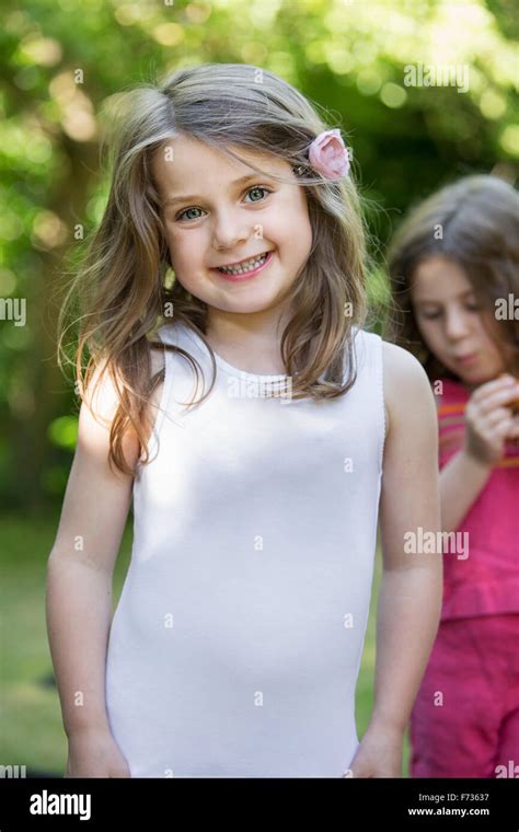 Two Smiling Young Girls At A Garden Party Stock Photo Alamy