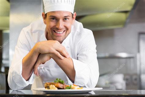 Smiling Male Chef With Cooked Food In Kitchen — Stock Photo