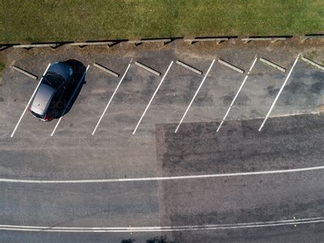 Image Of Single Car Parked In Angled Parking Space Seen From Above