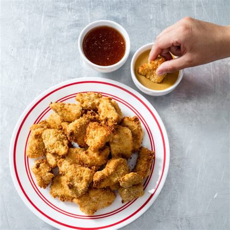 Less time, less fat, less calories… and all of the yumminess! Air-Fryer Chicken Nuggets | America's Test Kitchen