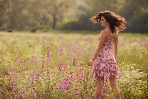 Beautiful Young Woman In Spring Flowers Outdoors Stock Photo Image Of