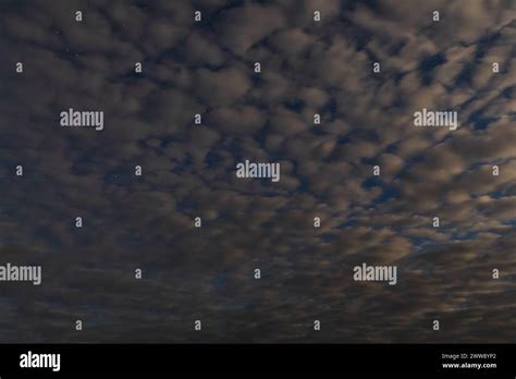 Twilight's Embrace: Clouds and Starlight Stock Photo - Alamy