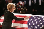 Mrs. Reagan touches the coffin of her husband during his state funeral ...