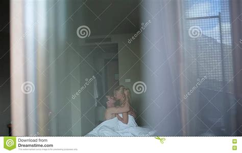 Couple Embracing Lying On Their Bed Stock Footage Video Of