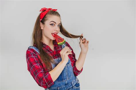 Pretty Pinup Girl Standing Licking Red Heart Shape Lolly Pop Enticingly Pleased Face