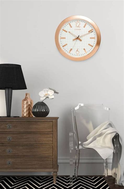 A Room With A Dresser Lamp And Clock On The Wall