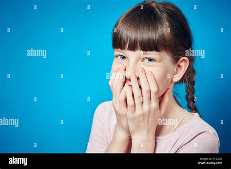 Shy Smiling Embarrassed Girl Covering Mouth With Hands Young Cute