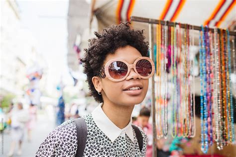 Beautiful Afro Woman Wearing A Pair Of Sunglasses Stock Image