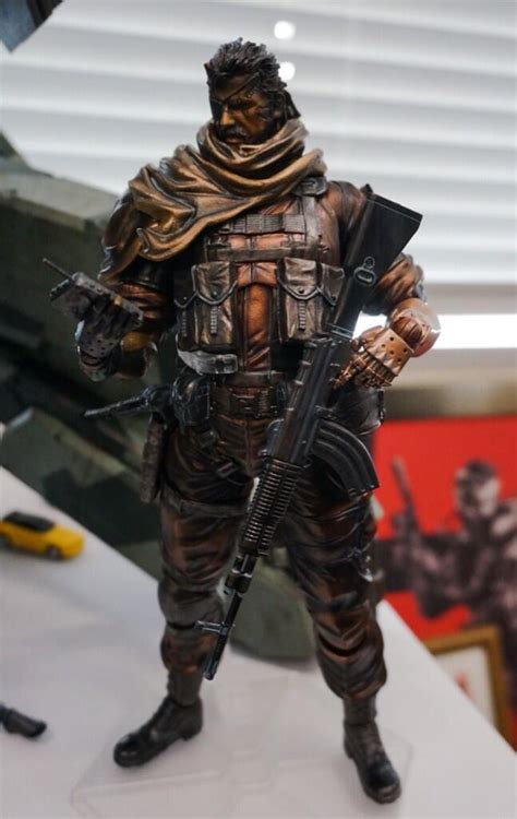 The phantom pain, released in 2015, lost his arm in an explosion and has a red and black bionic arm, complete with detachable missile. Play Arts Kai Metal Gear Solid Venom Snake SDCC 2014 ...