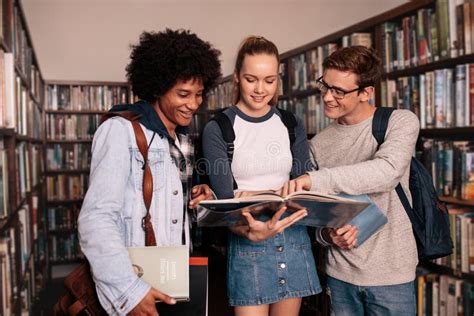 University Students Studying Together In Library Stock Photo Image Of