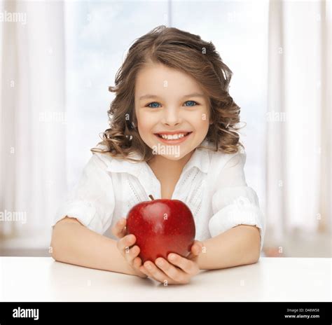 Girl With Red Apple Stock Photo Alamy