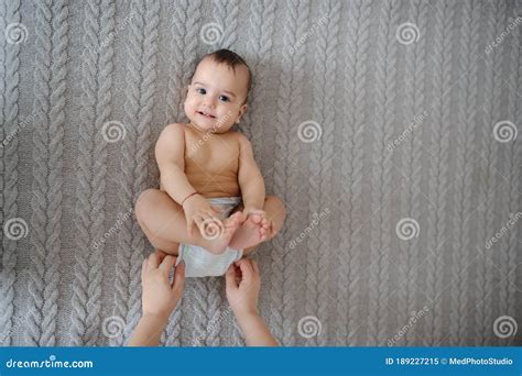 Cute Naked Baby Girl Lying On A Gray Blanket At Home Stock Image My