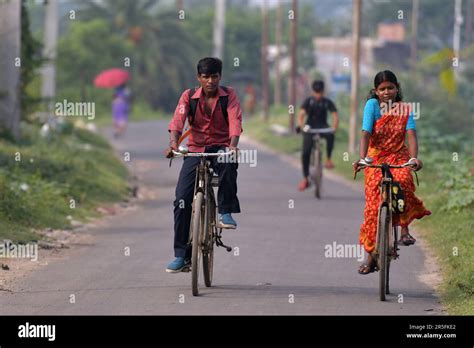 Villagers Riding Bicycles On World Bicycle Day In The Newtown Area Of