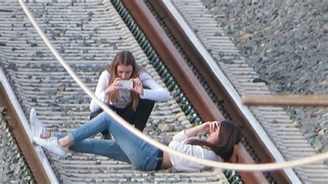 Young Girl Laying On A Railway Against Summer Landscape Hoodoo Wallpaper