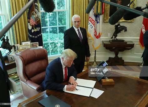 Us President Donald Trump Signs An Executive Order Imposing New