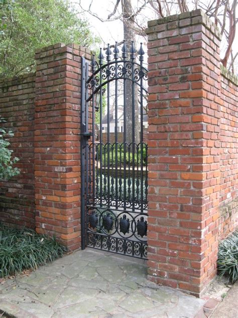 Woods like cedar can also be cut into different shapes to create a unique construction. Wrought iron gate set in a brick wall. | Wrought iron gate, Cottage garden, Iron gates