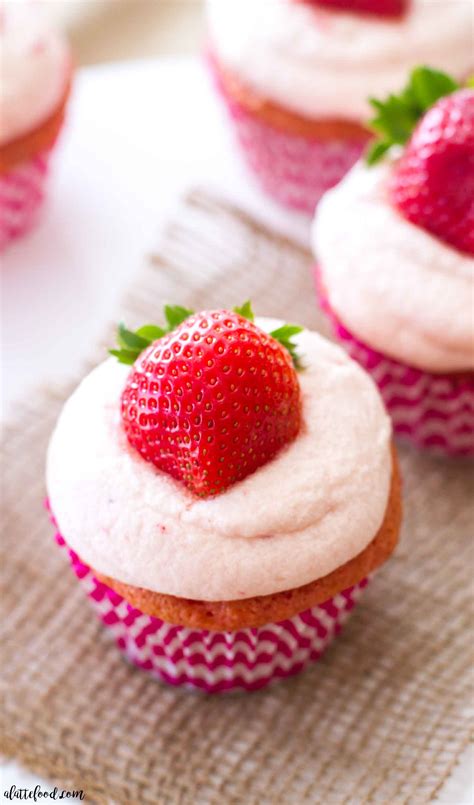 Sweet, fresh whipped cream is spread throughout this chocolatey cake with layers of fresh strawberries. Strawberries and Cream Cupcakes - A Latte Food