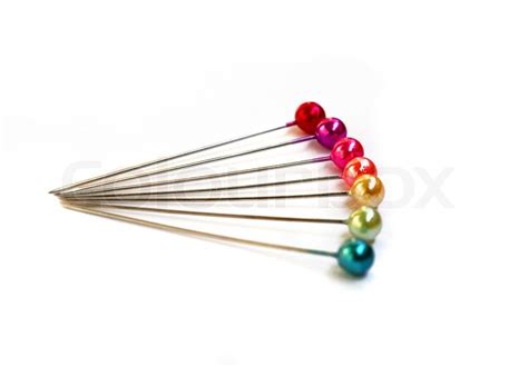Seven Colorful Sewing Pins On A White Background Stock