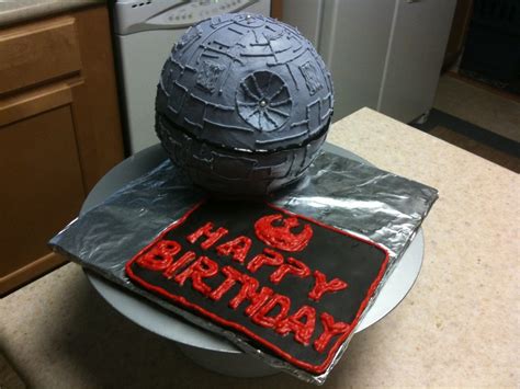 This cake is covered in a smooth buttercream then a stencil was used to add the design. Death Star Birthday Cake - CakeCentral.com