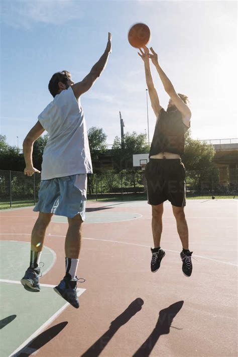Men Playing Basketball Stock Photo