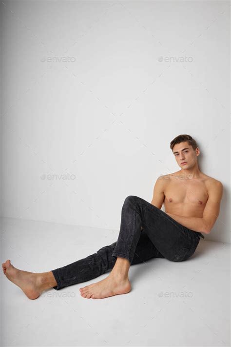 Man Sitting On Floor Naked Torso Posing Isolated Background Stock Photo