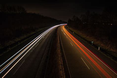 Timelapse Photography Of Cars Passing Through North And South Night