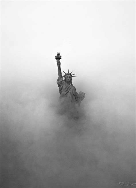 The Statue Of Liberty Is Surrounded By Fog