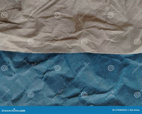 Crumpled Background Of Dark Blue Paper And Beige Tissue Paper Stock