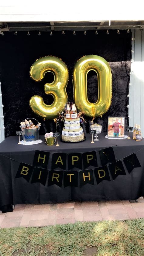 If you buy from a link, we may earn a commission. 30th birthday party ideas, men black and gold party, beer ...
