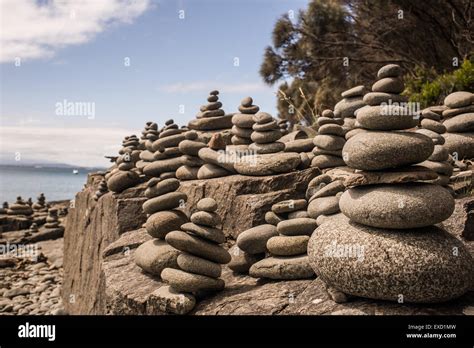 Pebbles And Rocks Stacked On The Ocean Shore Stock Photo Alamy