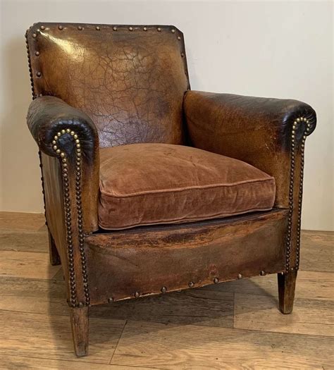 Pair of 1930s/40s french 'moustache' chairs; ANTIQUE LEATHER ARMCHAIR