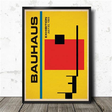 A Poster With The Words Bauhaus On It In Black And Yellow Against A