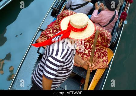Gondolier In A Gondola To Attract Tourists In Simulated Venetian Stock