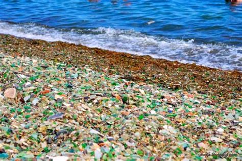 ussuri bay in russia has turned liquor bottles into colorful glass “pebbles” and it s breathtaking