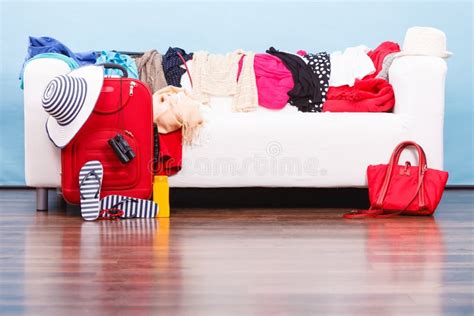 Messy Colorful Clothes Lying On White Sofa Stock Photo Image Of Messy