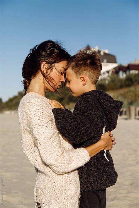 Young Mom Hugging Son At Beach By Stocksy Contributor Danil Nevsky