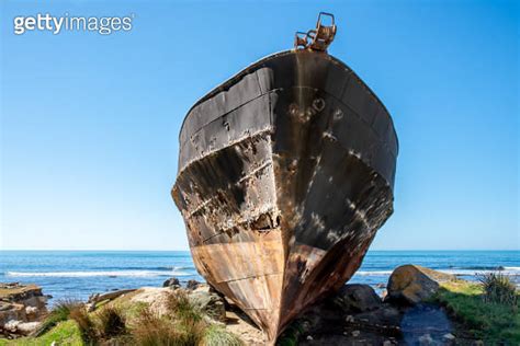 Abandoned Rusty Shell Of The Old Shipwreck Magnet Beached On Wairarapa