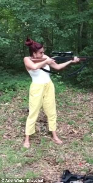 Ariel Winter Covers Up To Shoot Gun During Target Practice Daily Mail